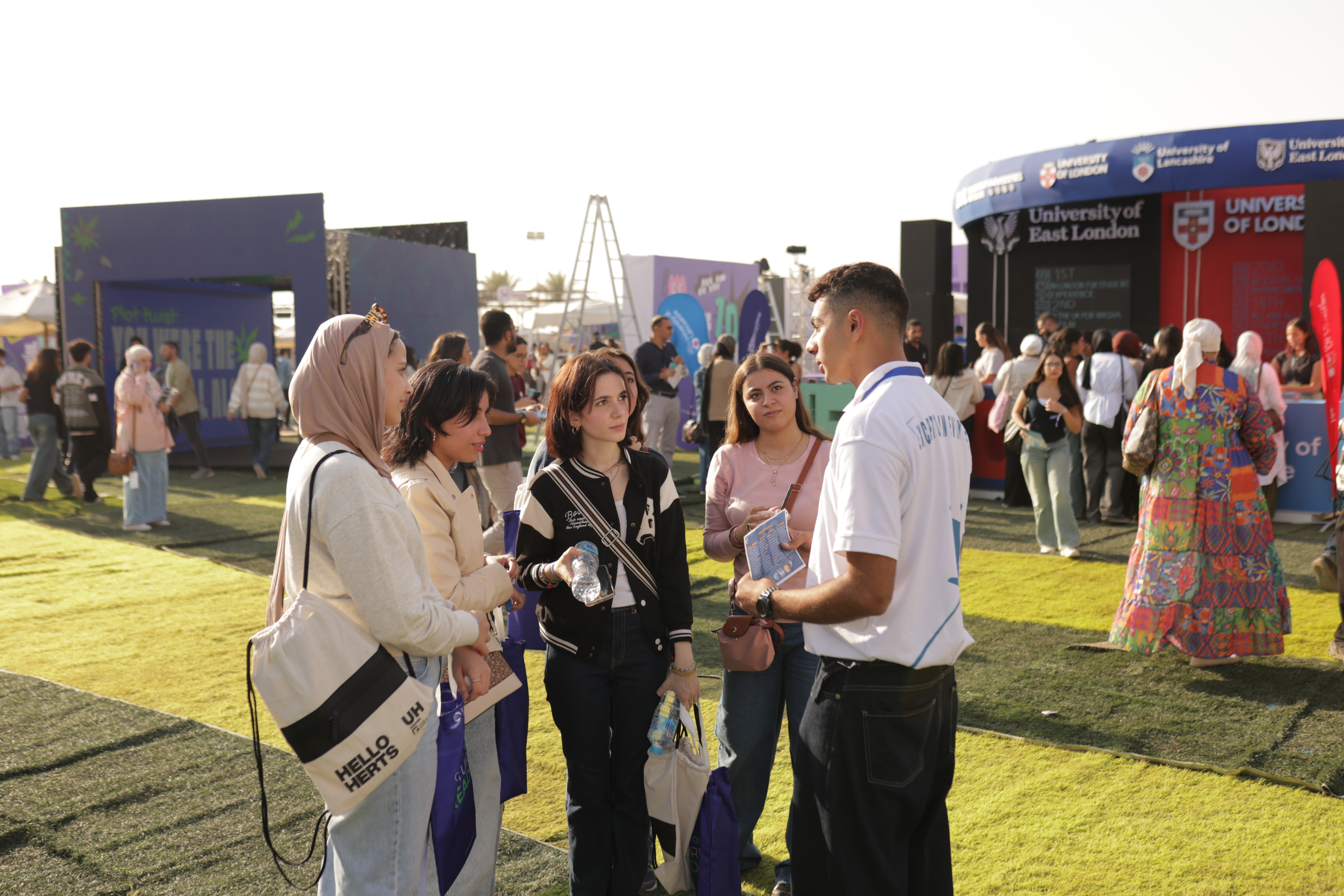 Students meeting at an outdoor university fair
